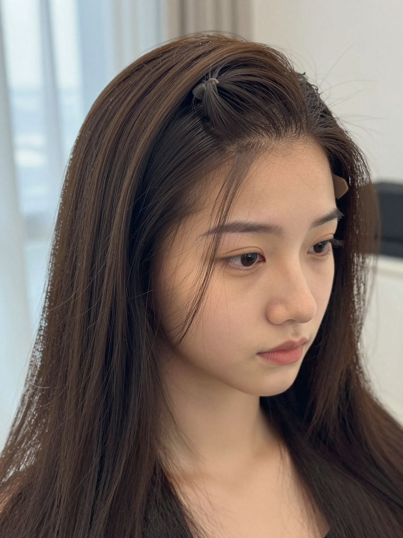 Close-up of a tinted, plucked lace frontal edge blending into the scalp